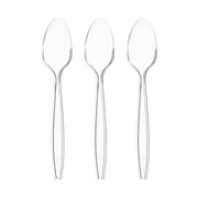 Premium clear medium heavy weight plastic teaspoons shown fanned out, showing the tapered handle and crystal-clear finish of this disposable flatware.

