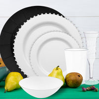 Premium wedding dinnerware set blending black chargers with silver details for a luxe finish.