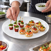 Product size dimensions for jumbo 18 inch white round plastic tray, showing the maximum diameter for professional food service and catering