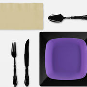Ravens-themed dinnerware featured on a styled table setup with snacks and team décor.