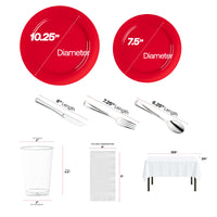 Red dinner and salad plates pair with silver flatware for a vibrant table display.