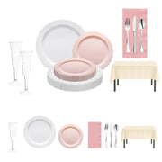 Romantic dinner setup with white dinner plates, pink salad plates, and silver cutlery from The Love Actually Set