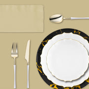 Romantic disposable tableware package with coordinated clear and gold elements for receptions.