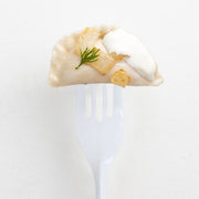 SKU 751-CASE labeled on packaging with stacks of white medium-weight plastic forks ready for use