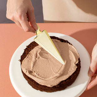 Shiny Gold Cake Cutters were used to serve elegant dessert slices at upscale events.