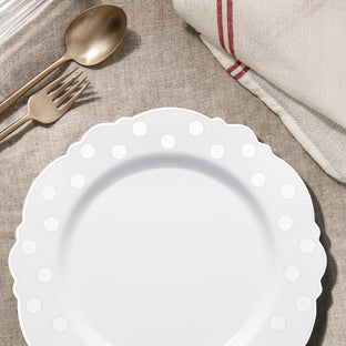 Silver Dotted White Plates were used for main courses during a stylish anniversary dinner.