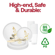 Sophisticated table setting featuring coordinated dinner and salad plates, gold cutlery, and clear cup