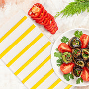 Sophisticated white paper napkins with gold stripes, perfect for entertaining guests at formal or casual events