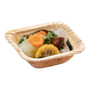 A Square Palm Leaf Eco Friendly Mini Disposable Bowl (1.5 oz.) filled with assorted steamed vegetables, including sliced carrots, corn on the cob, cabbage, mushrooms, and some fresh cilantro garnish sits on a white background. This eco-friendly presentation makes it perfect for sustainable dining.