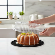 Stackable black trays with transparent lids simplify chilling, storing, and moving prepared platters from kitchen to venue