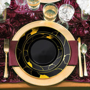 Stylish black round plastic dinner plates with intricate gold marble detailing, 10-inch size, sold in a 120-pack