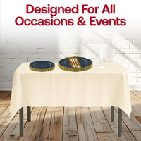 Stylish holiday table with the Resting Grinch Face Sets navy plates and gold flatware