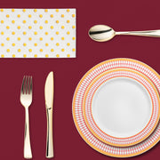 Stylish indoor dinner scene with regal tones and upscale disposable plates and flutes