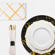 Stylish sweetheart table featuring The Golden Hour Package, gold accents, and floral centerpieces for an elegant celebration.