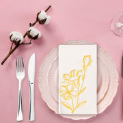 Stylish white paper napkins with vintage gold floral accents, adding sophistication to weddings and formal dinners