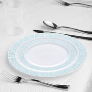 Table Setting: Burgundy disposable tablecloths, navy paper napkins, and clear plastic cups complement the silver cutlery and mosaic-rimmed plates