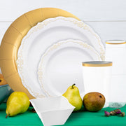 Table setup under soft lighting showcasing gold-accented plates and flatware
