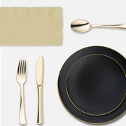 Tailgating made chic with a black and gold themed table spread featuring disposable elegance.