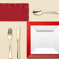 The XOXO Dinnerware Set on a sweetheart table for an anniversary dinner with soft lighting and floral accents