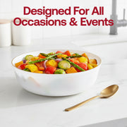 Three small white plastic bowls with gold trim served with macarons and fruit on a white tablecloth for an outdoor garden party.