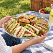 Top-down view of a 16-inch tray styled with cupcakes and clear dinnerware for cohesive setup