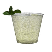 Trendy disposable plastic cups with a clear and silver glitter design, 9 oz, enhancing any party table setting