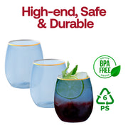 Two decorative light blue plastic stemless glasses with gold borders on an outdoor terrace, stylish disposable cups for cocktail hours and events.