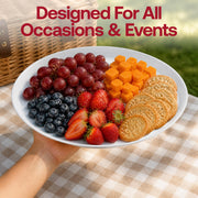Two large white disposable plastic trays served with fresh fruit salad and sliced bread, perfect for brunch catering and breakfast buffets