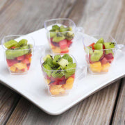 Versatile 2 oz. clear plastic square mini cups, perfect for serving hot or cold beverages, great for parties, catering, and elegant presentations