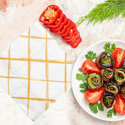 Versatile gold diamond patterned cocktail napkins on a white base, great for birthdays, showers, or corporate events