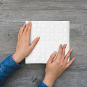 Versatile white napkins with silver dots, great for formal dinners, casual parties, and holiday entertaining