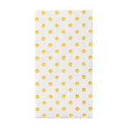 White dinner napkins with gold dots designed for all occasions, from birthdays and weddings to business events