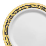 White plastic appetizer plate with a black and gold royal rim