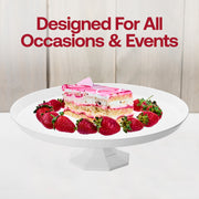 White plastic cake stands shown with SKU CS115W (11.6-inch top) and another with 10.5-inch top for size comparison.
