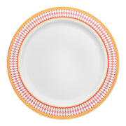 White plastic dinner plate with a red and gold chord design on the rim