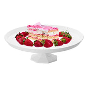 White round cake stand holding a layered cake topped with strawberries, ideal for elegant dessert displays
