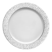 White round plastic dinner plates with a decorative silver hammered rim