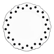 White round plastic dinner plates with an artistic black blossom dot design