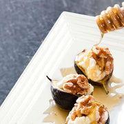 White serving tray at a wedding reception, showcasing a beautifully plated meal for guests