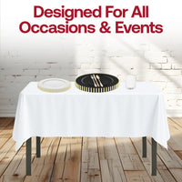 White tablecloth and gold-rimmed dishes in the Dear Santa Set shine in a candlelit setting.