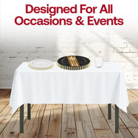 White tablecloth and gold-rimmed dishes in the Dear Santa Set shine in a candlelit setting