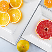 White with Silver Rim Dinner Plates used to serve entrees like salmon at a silver-themed celebration