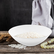 White with Silver Rim Organic Round Disposable Plastic Soup Bowl elegantly served with fluffy white rice and herbs