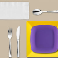 Yellow and purple Game Day Set arranged with cupcakes, chips, and spirited tablecloths