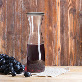 sleek and functional 35 oz. Clear Large Disposable Plastic Wine Carafes with Lids  ideal for buffets